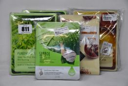 Two packs of 10pcs Tony & Moly pureness green 100 mask sheets, one pack of 10pcs Esfolio snail