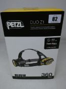 A boxed as new Petzl Duo Z1 powerful, waterproof and rechargeable headlamp.
