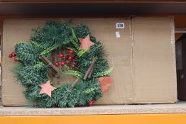 Eight boxed Glo Brite LED door wreaths.