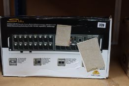 A boxed Behringer S16 Digital Stage Box.