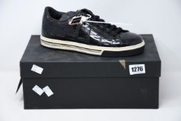 A pair of as new Dolce & Gabbana sneakers (TG 410).