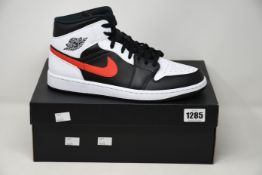 A pair of as new Nike Air Jordan 1 Mid (UK 10).