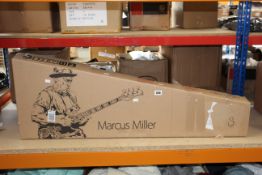 A boxed Sire Marcus Miller V7 swamp ash-4 2nd gen bass guitar.