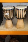 Two pre-owned single drum bongos.