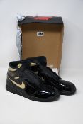 A pair of as new Nike Air Jordan 1 Retro High OG in black/metallic gold (UK 9.5 - No box lid).