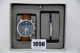 An as new Fossil Neutra chronograph luggage leather watch and bracelet set.
