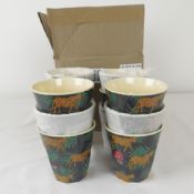 Twelve boxed as new Rice melamine cups in leopard and leaves