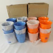 Twelve boxed as new Rice melamine cups in dusty blue and twelve Rice melamine cups in tangerine