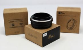 Three boxed as new Fikaz Lens Adaptors; 1 x Nikon to Canon EOS R, 1 x Canon EOS to Nikon Z, 1 x