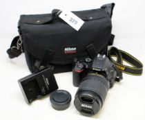 A pre-owned Nikon D5600 DSLR with a Nikon AF-S DX NIKKOR 18-140mm f/3.5-5.6G ED VR Lens, Battery,