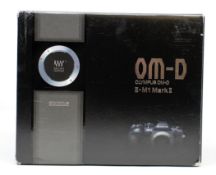 A boxed as new Olympus OM-D E-M1 Mark II Camera in Black (Body Only) (Box opened, some damage to