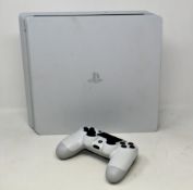 A pre-owned Sony PlayStation 4 Slim CUH-2116A Gaming Console in White with one Sony wireless