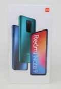 A boxed as new Xiaomi Redmi Note 9 128GB in Onyx Black Checkmend report ID: CM17166298-69F42) (Box