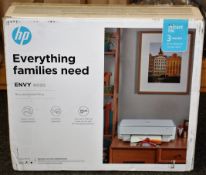 A boxed as new HP ENVY 6020 Wireless All-in-One printer (Box not sealed) (Some damage to box).