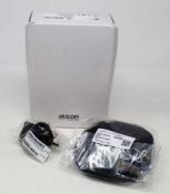 A boxed as new Oticon Charger 1.0 miniRITE R in Black for Oticon More, OPN & Ruby hearing aids (