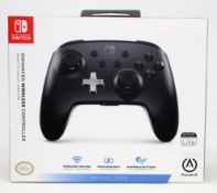 A boxed as new Nintendo Switch Enhanced Wireless Controller in Black (Box Sealed).