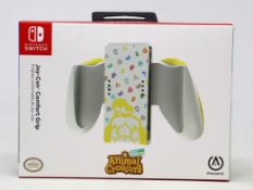 Four boxed as new Animal Crossing Nintendo Switch Joy-Con Comfort Grip (Boxes sealed).