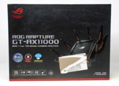 A boxed as new ASUS GT-AX11000 ROG Rapture 802.11ax Tri-Band Gaming Router (Box opened, damage to