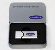 An as new Amplivox Audibase 5.5.101 Audiogram Database Software and Manuals USB Flash Drive in metal