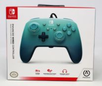 Two boxed as new Nintendo Switch Enhanced Wired Controller in Aquatic Fantasy (Boxes sealed).