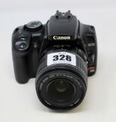 A pre-owned Canon Rebel XTi DSLR Camera with EF-S 18-55mm f/3.5-5.6 II Lens and Battery (Untested,