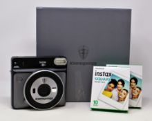 A boxed as new Koenigsegg Special Edition Fujifilm Instax Square SQ6 Instant Film Camera with strap,