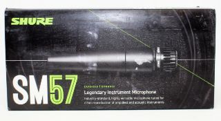 A boxed as new Shure SM57 Cardioid Dynamic Instrument Microphone (Box opened, some damage to box).
