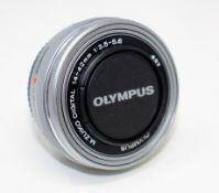 A pre-owned Olympus M. Zuiko 14-42mm f/3.5-5.6 EZ ED MSC Micro Four Thirds Lens.