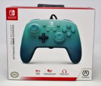 Two boxed as new Nintendo Switch Enhanced Wired Controller in Aquatic Fantasy (Boxes sealed).