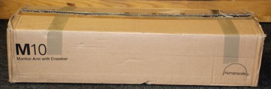 A boxed as new Humanscale M10 Monitor Arm with Crossbar (Box opened, some damage to box).