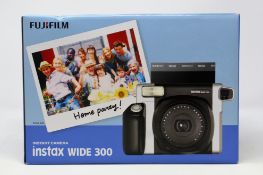 A boxed as new Fujifilm Instax Square SQ6 Instant Film Camera in Black/Silver (Box opened).