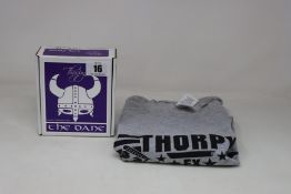A boxed Thorpy FX The Dane Boost and Overdrive Pedal with a Thorpy FX t-shirt in grey (XL).