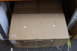 A boxed Power Plate Move vibration plate in red.