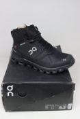 A pair of women's as new On Cloudrock waterproof hiking boots (UK 6.5).