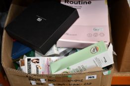 A box of assorted as new luxury beauty products.