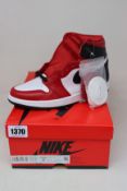 A pair of women's as new Nike Jordan 1 Retro High Satin Snake Chicago (UK 4).