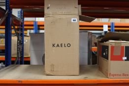 A boxed Kaelo integrated wine cooler in brushed black.