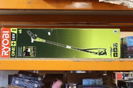A boxed Ryobi One + 18v cordless pole saw.