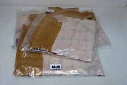 Four as new Unmade Copenhagen Imone scarves (RRP £45 each).