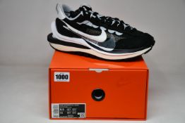 A pair of as new Nike Vaporwaffle/Sacai trainers (UK 8.5).