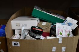 A box of assorted as new luxury beauty products.