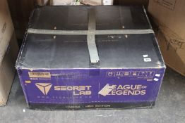 A boxed Secret Lab KDA Edition League of Legends Gaming Chair.