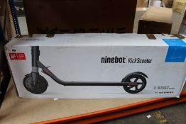 A boxed Segway Ninebot KickScooter in black (Box opened).
