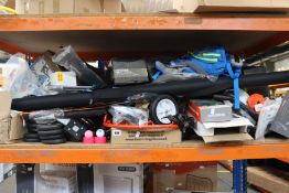 A shelf of assorted sports and leisure items.