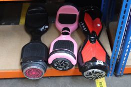 Three pre-owned hoverboards to include a VOYAGER HOVER-4040HB-PNK and a two-wheeled HY-A02 (Bags and