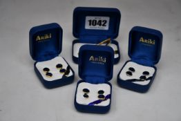 Two 22 carat gold plate Paua ablone shell shirt stud sets (Four per set), a set of palladium plate