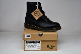 A pair of as new Dr Martens Vegan 1460 8 Eye boots (UK 7).