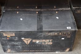 A boxed Secret Lab Omega 2020 black gaming chair.