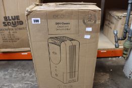 A boxed EcoAir DD1 Classic Dehumidifier.
