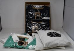 Six items of as new Football Town clothing; Rampant Lion shorts (L), Clover shorts (L), The Clover